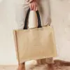 Man Holding Natural/Black Classic Jute Shopper – Coloured Handles