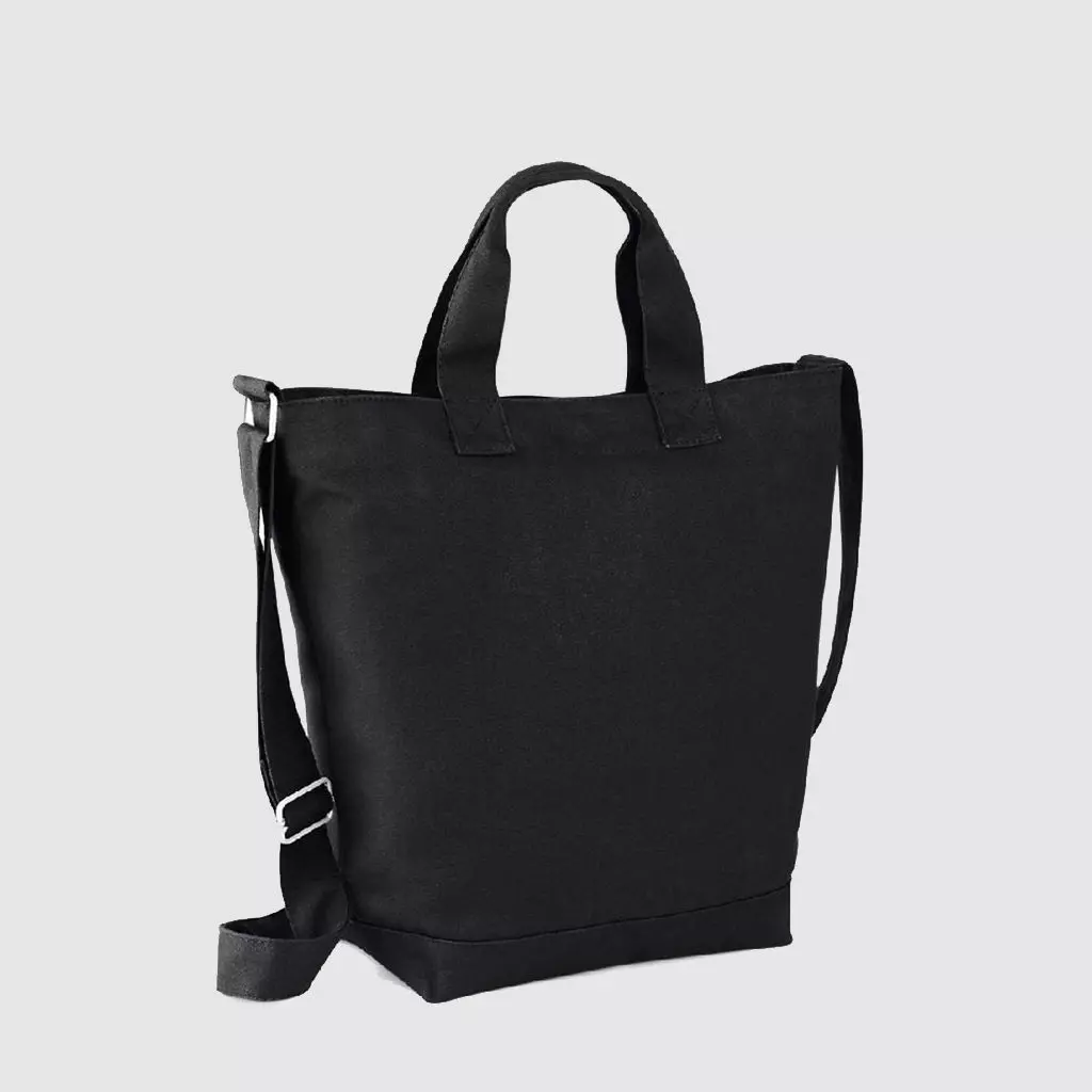 Custom sling bag, in black with top handle and adjustable cross-body/shoulder strap. Zip top closure and wide base