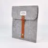 grey felt ipad case with brown leather strap detail