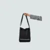 black A4 sling bag with removable shoulder carry strap