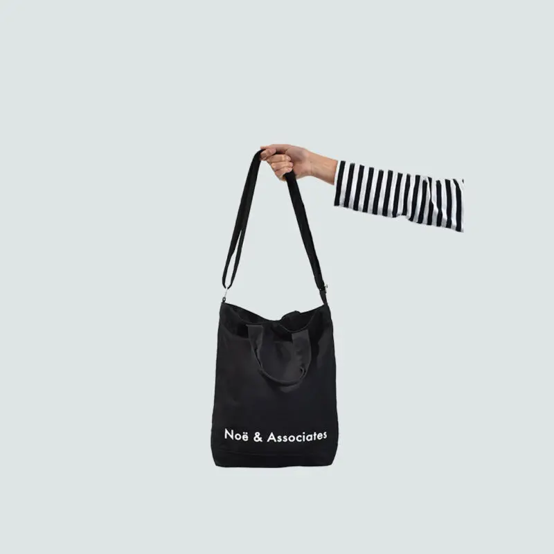 black A4 sling bag with removable shoulder carry strap