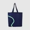 edge to edge print in mint green on large tote bag in navy