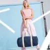 Women Holding Denim/ White Duffle Bag