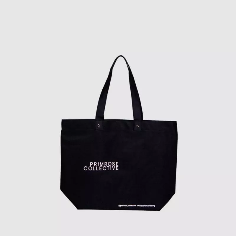 Shoulder bag customised with print and metal rivets