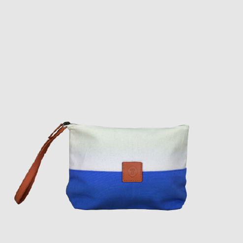 custom travel pouch in two tone canvas with leather strap and logo badge