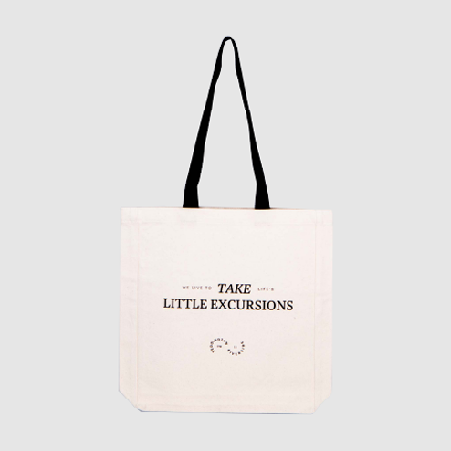 welcome gift bag in natural with black handles