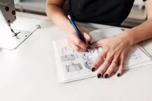 hand with pen drawing sketch for bag