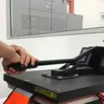 DTF print machine printing a bag