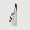 natural canvas tote bag with tan colour PU leather handles