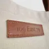 natural canvas tote bag with tan colour PU leather embossed badge