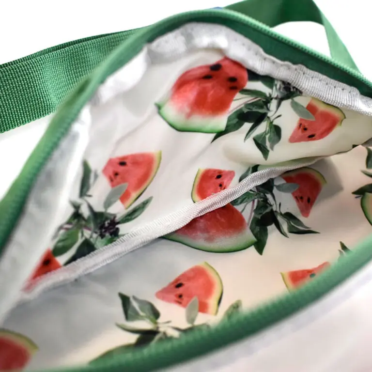 up close image of detailed watermelon print on inside of open zipped bum bag for Grey Goose
