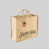 brown square jute bag with short hand carry handles