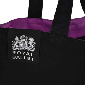 black Royal Ballet bag with purple lining and silver woven label