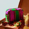 terry cloth wash bag on a table with sunglasses and sun cream next to it