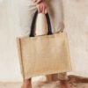 Man Holding Natural/Black Classic Jute Shopper – Coloured Handles