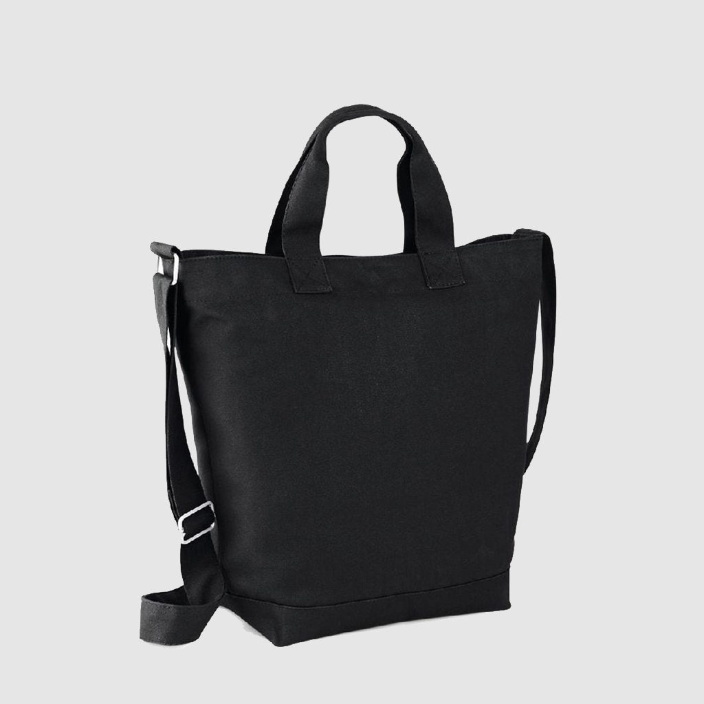 Custom sling bag, in black with top handle and adjustable cross-body/shoulder strap. Zip top closure and wide base