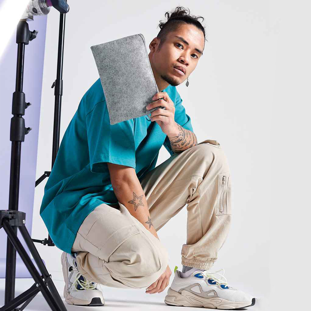 Grey Felt Zipped Accessories Case Held By Student