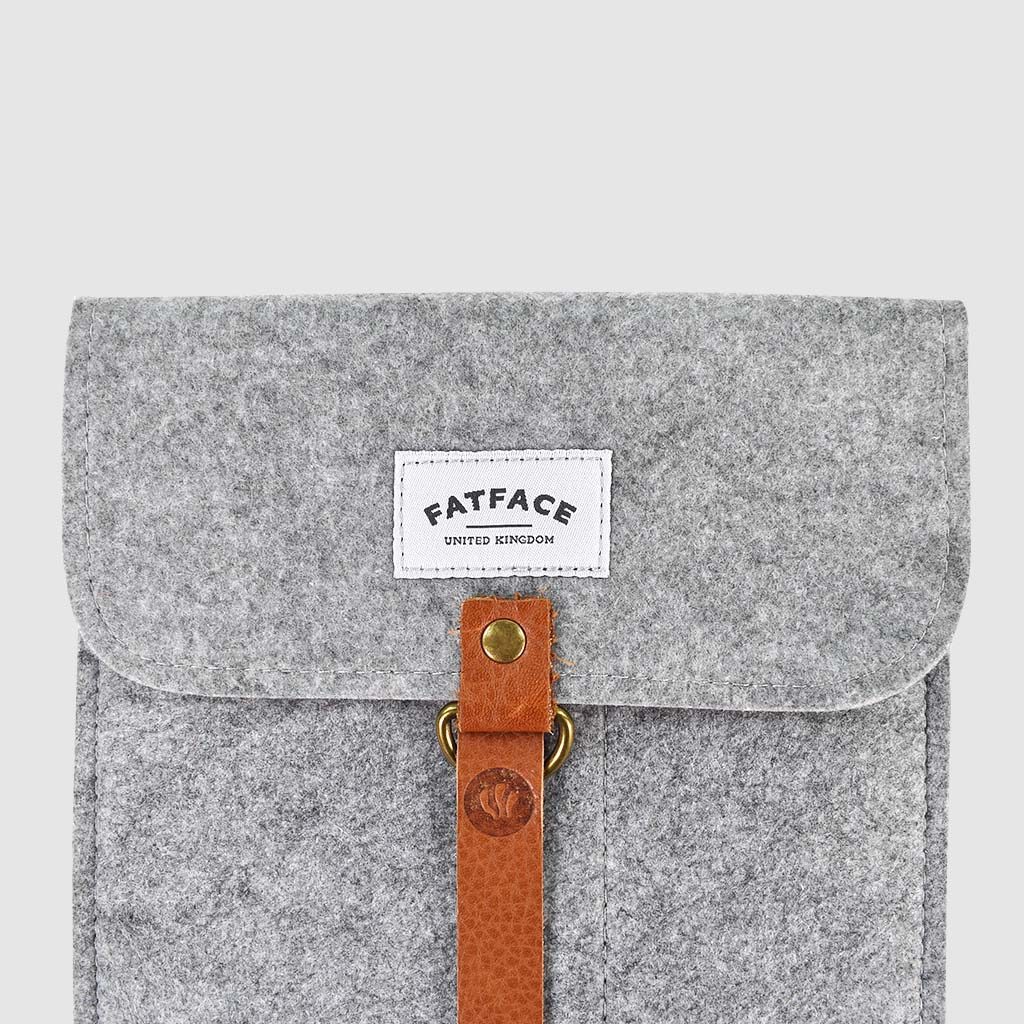 woven brand label on felt folder