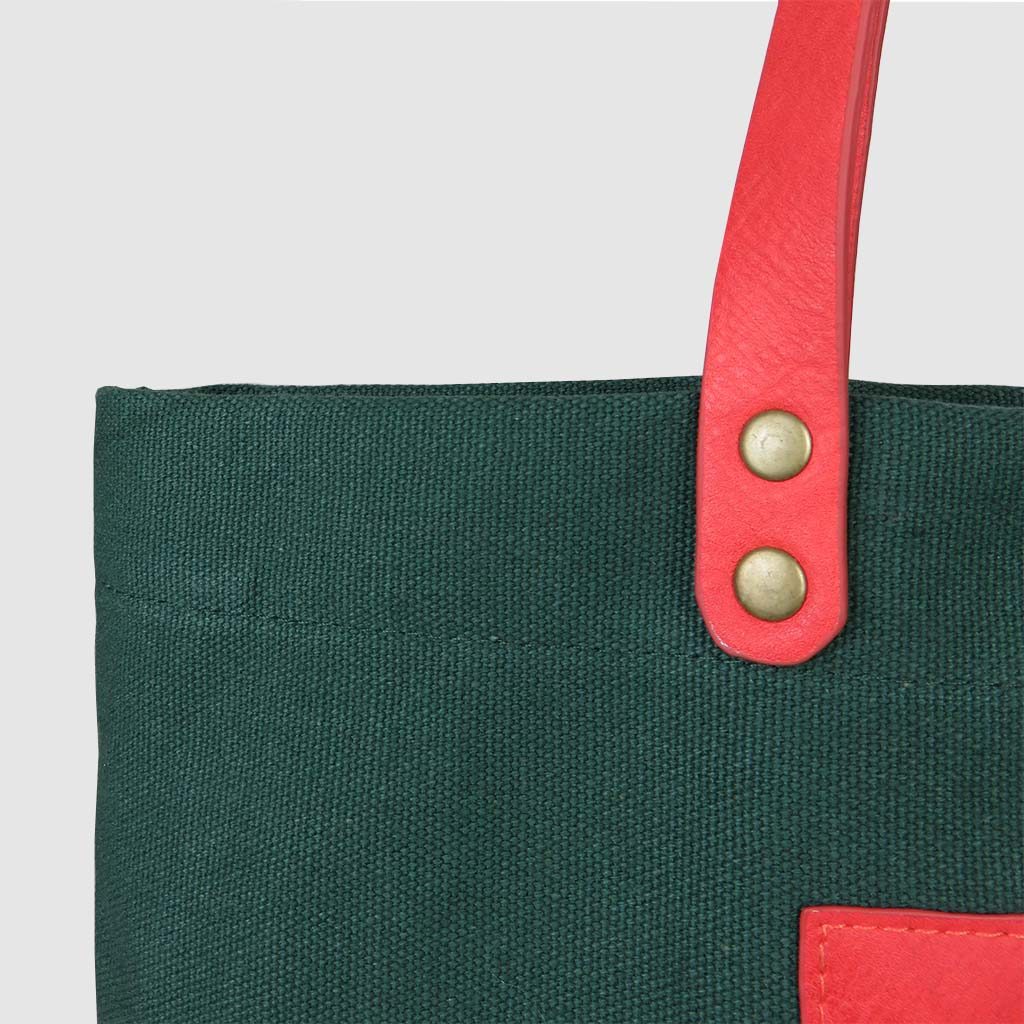 custom premium tote bag with metal rivets on pink leather
