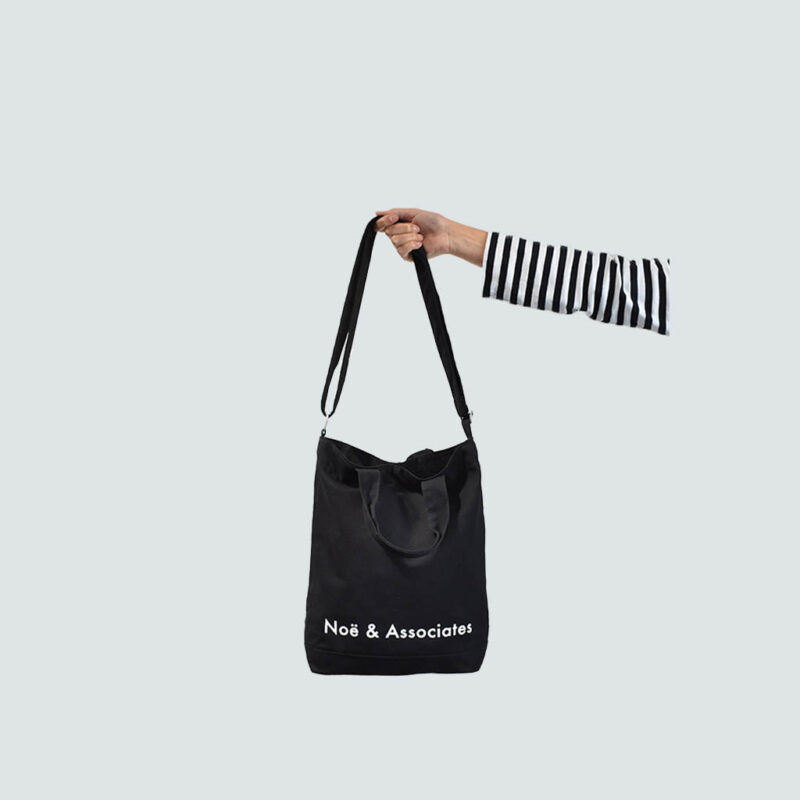 black A4 sling bag with removable shoulder carry strap