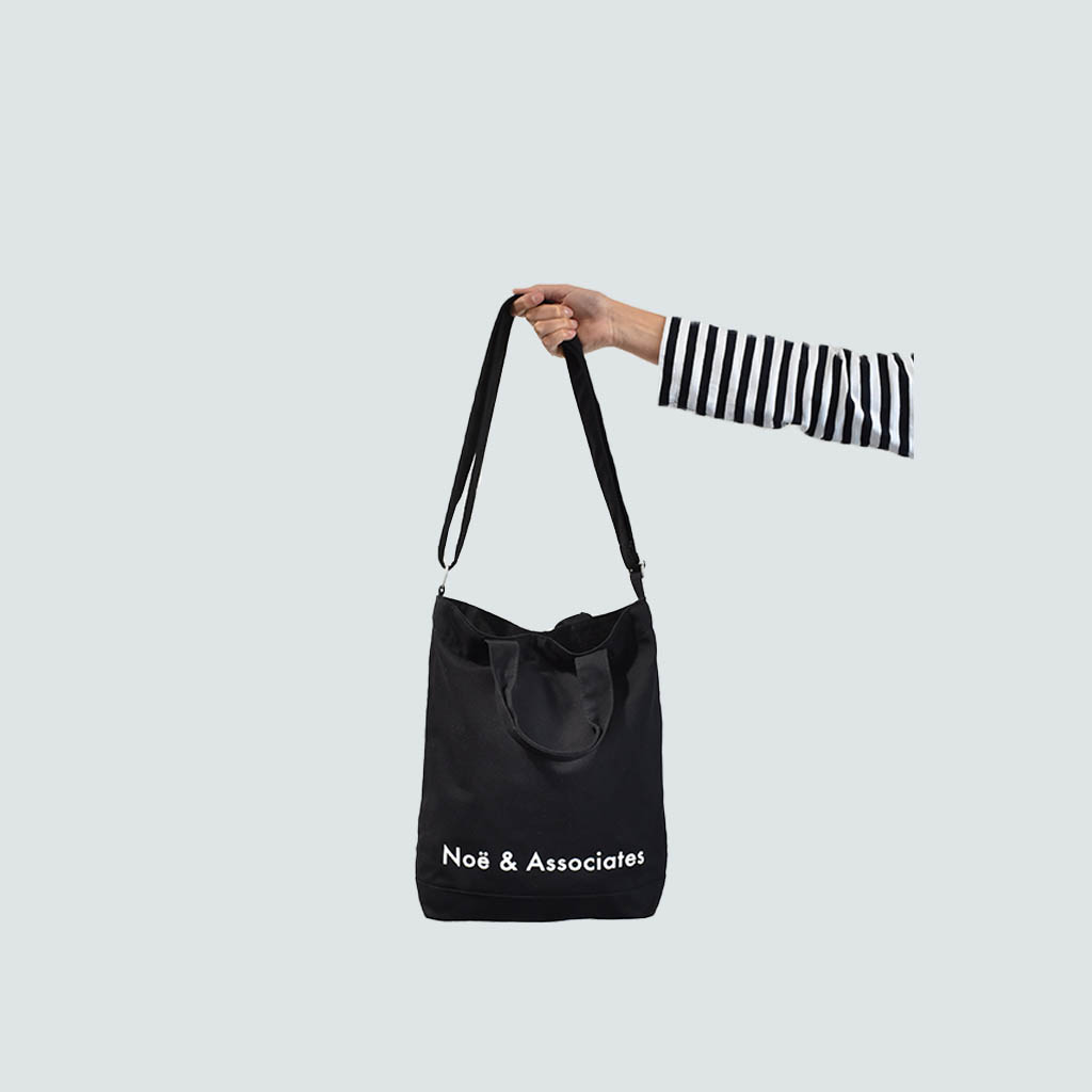 black A4 sling bag with removable shoulder carry strap