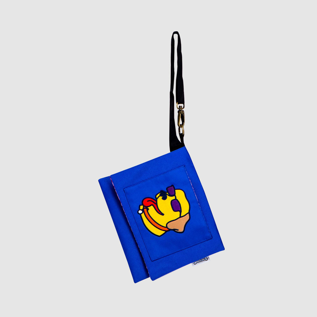 custom cross body bag in royal blue polyester with applique dog on front flap with adjustable black strap