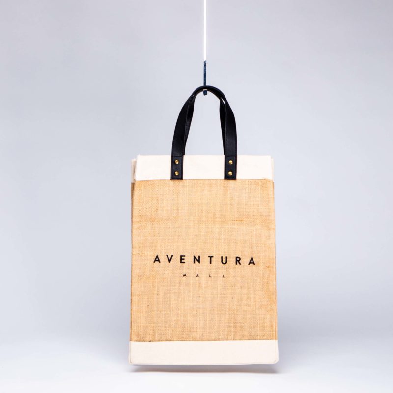 sustainable fabric jute and canvas bag with black leather handles
