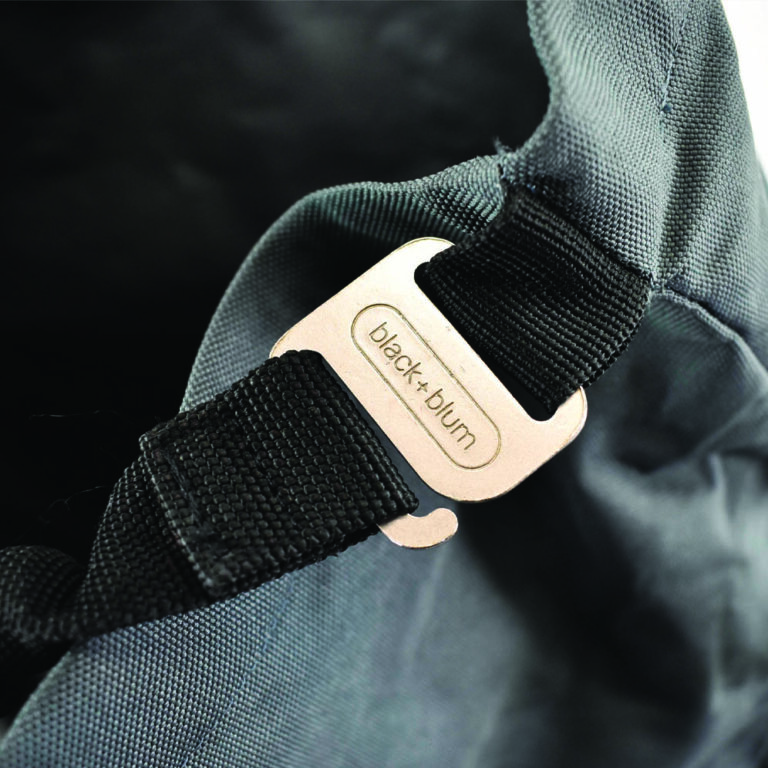 engraved metal buckle on bag in development stage