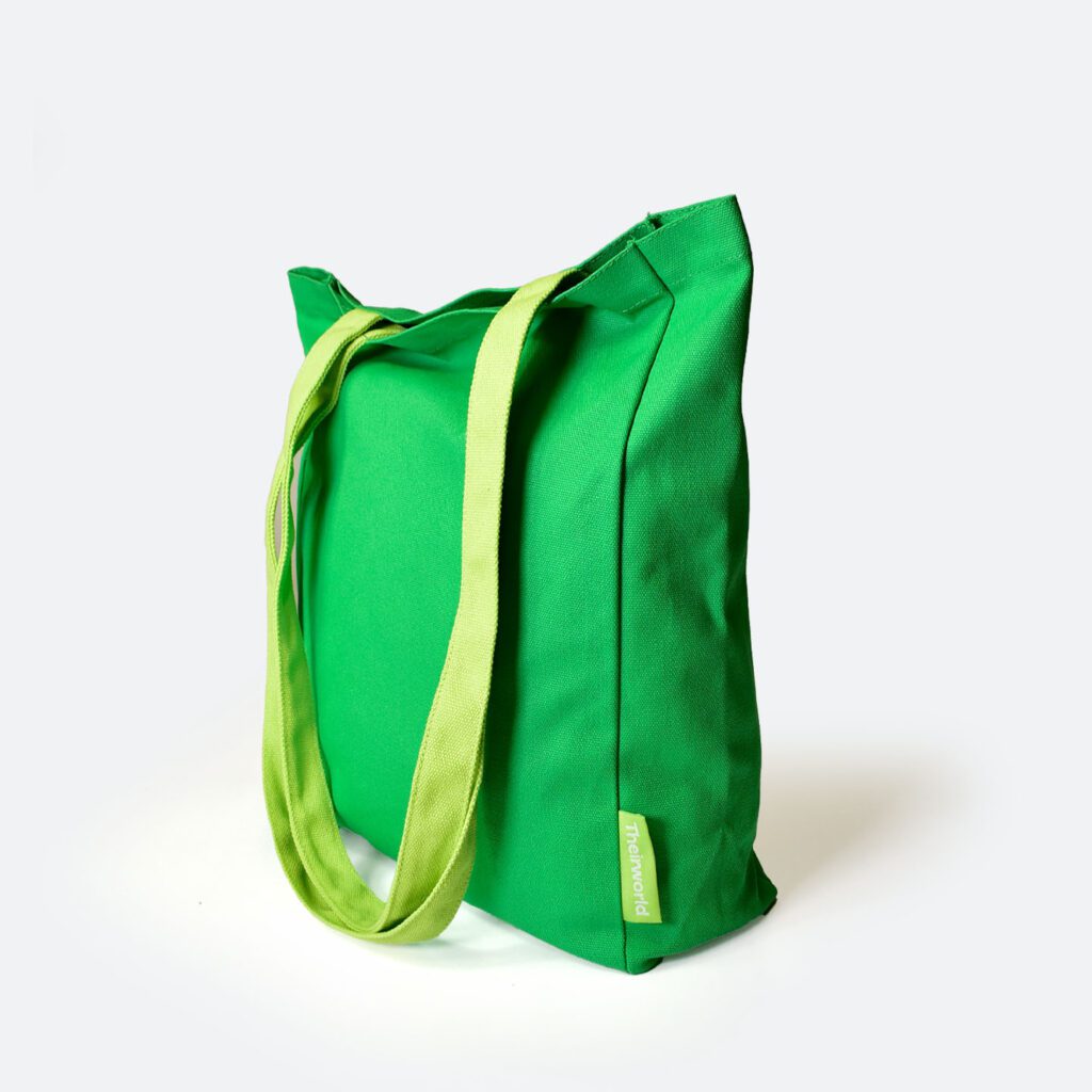 side view of green A4 bag with lime green handles