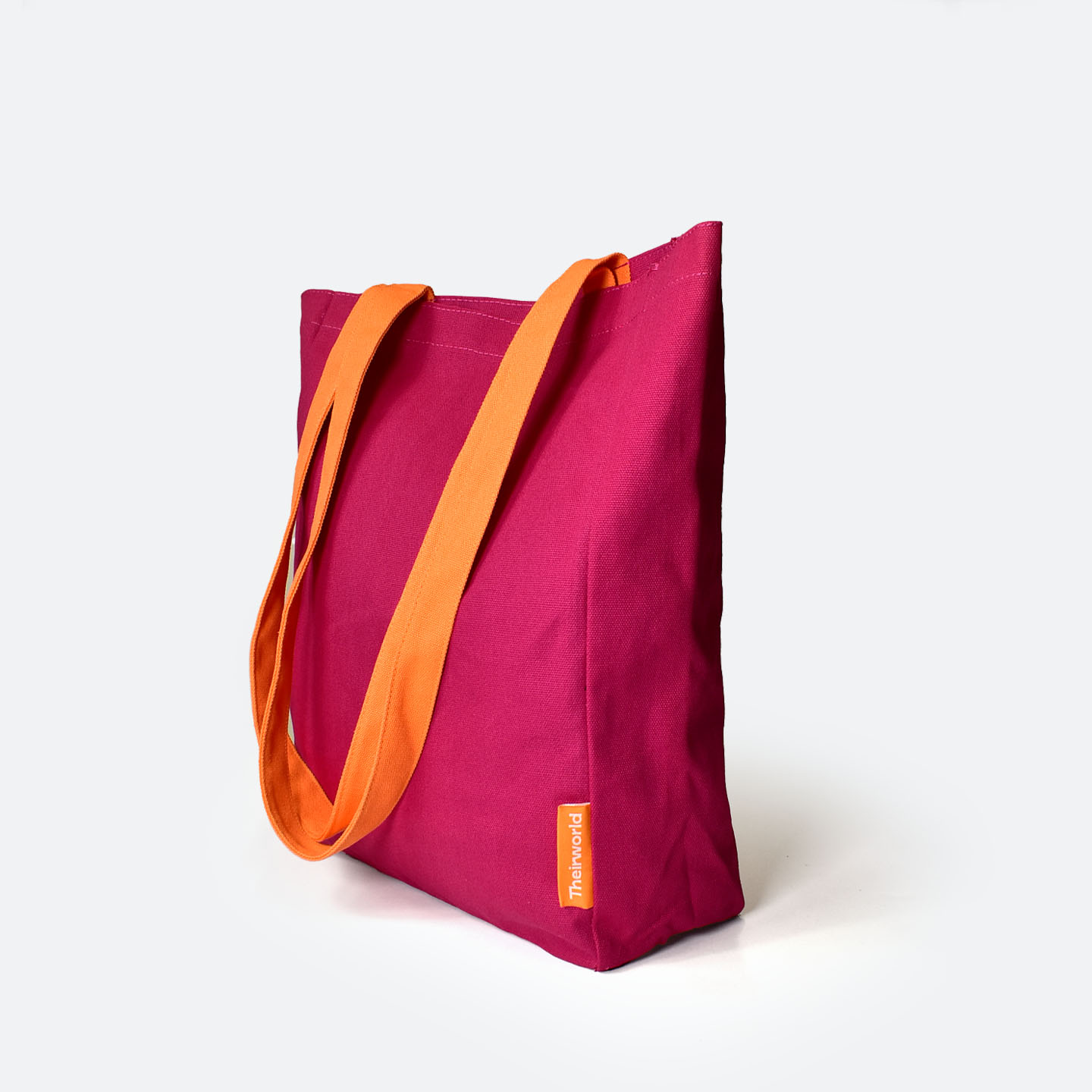 Side view of A4 bag in pink with orange handles