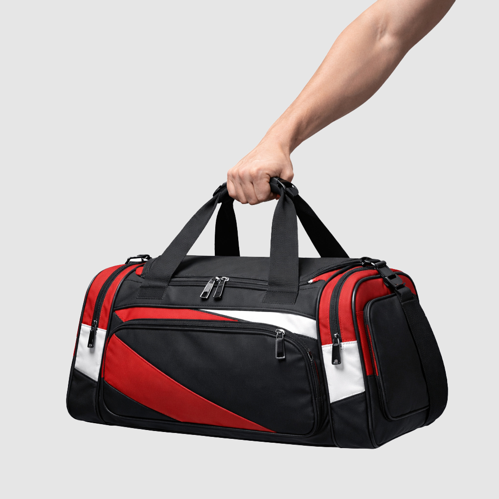 arm holding a black and red sports bag with short handles