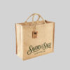 brown square jute bag with short hand carry handles