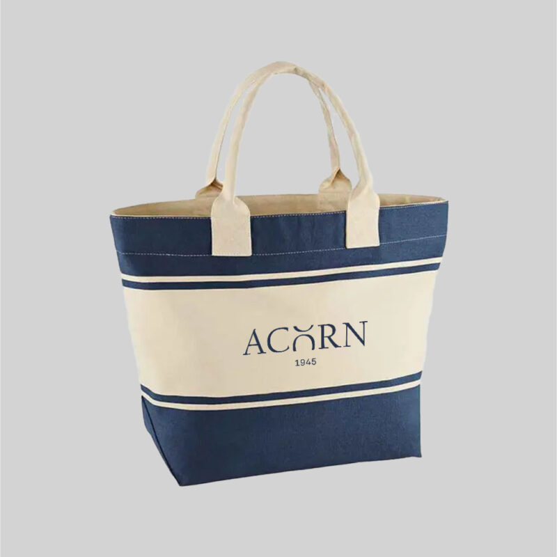 blue and natural coloured beach bag with short natural carry handles