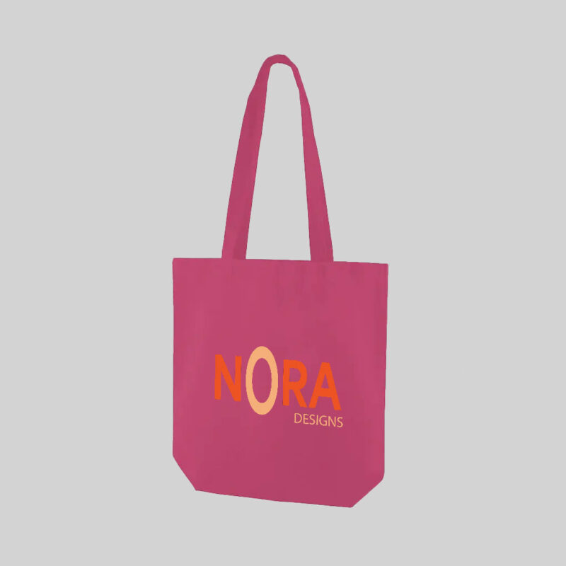pink tote bag with orange print and long handles