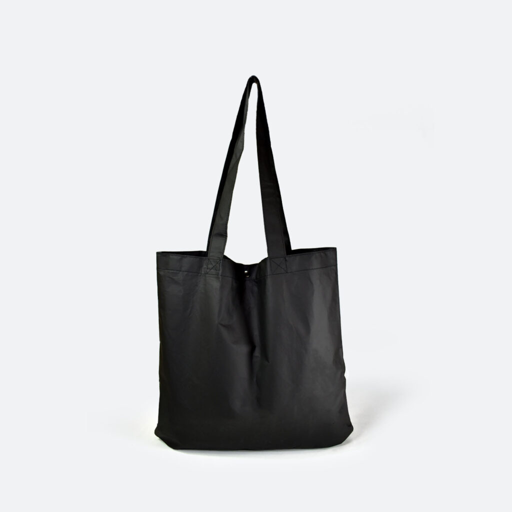 black tyvek tote bag with long handles and silver metal popper closure