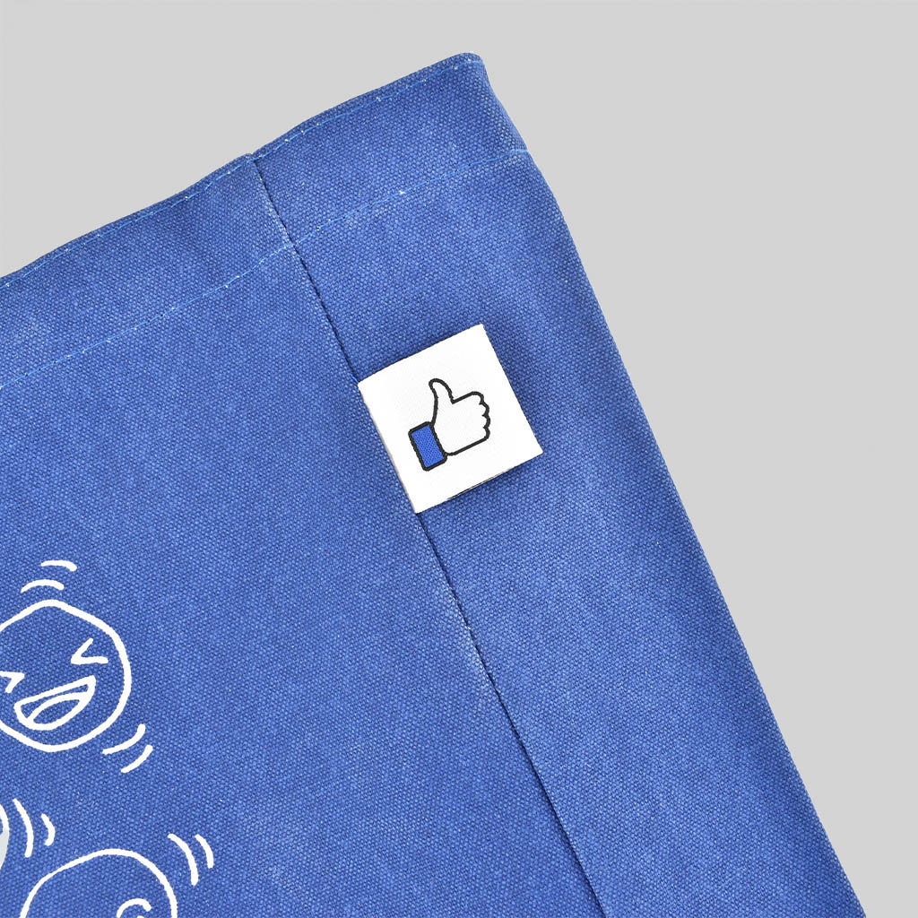 blue carryall with white woven label for how to work with a British vendor