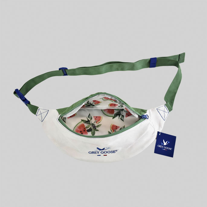 Grey Goose branded belt bag with green adjustable straps for how to work with a British vendor