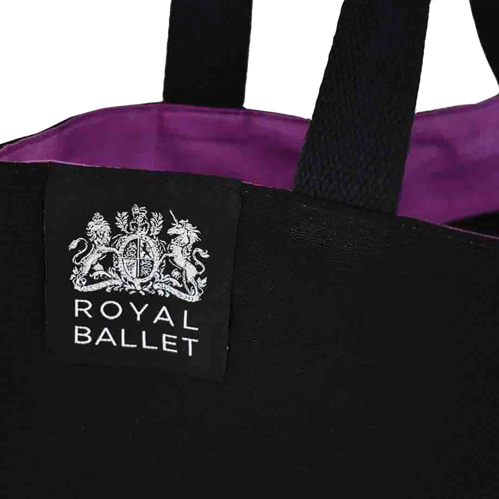 black Royal Ballet bag with purple lining and silver woven label