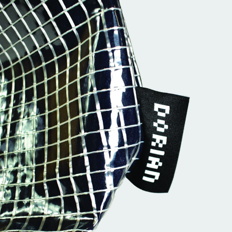 woven logo label on side panel of clear bag
